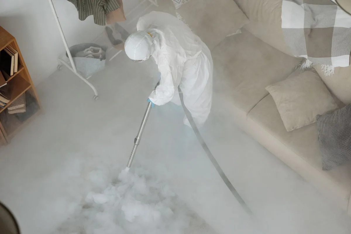 Biohazard cleanup technician in protective equipment, Hebron, OH